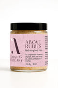 Jar of Above Rubies hydrating body polish with pink label on white background